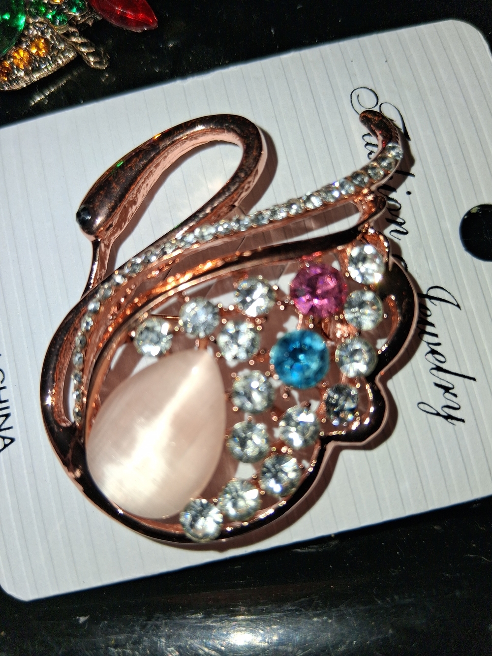 Rose Gold Multi-Stone Swan Brooch with Pink and Blue Accents